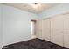Light bedroom with mirrored closet doors and carpet flooring at 8141 E Apache Plumb Dr, Gold Canyon, AZ 85118