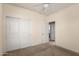 Bright bedroom with double door closet and carpet flooring at 8141 E Apache Plumb Dr, Gold Canyon, AZ 85118