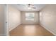 Spacious bedroom with wood flooring and large window at 8141 E Apache Plumb Dr, Gold Canyon, AZ 85118