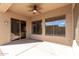 Covered patio with sliding glass door and ceiling fan at 8141 E Apache Plumb Dr, Gold Canyon, AZ 85118