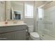 Clean bathroom with gray vanity, shower, and updated toilet at 8184 N 22Nd Dr, Phoenix, AZ 85021