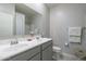 Double vanity bathroom with gray cabinets and tile floor at 8184 N 22Nd Dr, Phoenix, AZ 85021