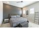 King-size bed in main bedroom with gray walls and decor at 8184 N 22Nd Dr, Phoenix, AZ 85021