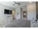 Bright bedroom featuring large TV and ample dresser space at 8184 N 22Nd Dr, Phoenix, AZ 85021