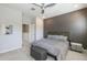 Spacious bedroom with modern ceiling fan and plush bedding at 8184 N 22Nd Dr, Phoenix, AZ 85021