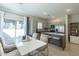 Open concept dining area with kitchen and patio access at 8184 N 22Nd Dr, Phoenix, AZ 85021
