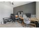Home office with built-in desk and exercise bike at 8184 N 22Nd Dr, Phoenix, AZ 85021