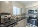 Modern kitchen with stainless steel appliances and granite countertops at 8184 N 22Nd Dr, Phoenix, AZ 85021