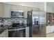 Modern kitchen with stainless steel appliances and granite countertops at 8184 N 22Nd Dr, Phoenix, AZ 85021