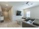 Living room with large TV and comfortable seating at 8184 N 22Nd Dr, Phoenix, AZ 85021