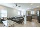 Spacious living room with modern furniture and ceiling fan at 8184 N 22Nd Dr, Phoenix, AZ 85021