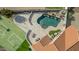 Backyard aerial view featuring a pool, spa, seating, and basketball court, perfect for relaxing and entertaining at 905 E Knight Ln, Tempe, AZ 85284