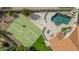 Beautiful aerial view showcases a backyard with a basketball court, swimming pool, and patio area at 905 E Knight Ln, Tempe, AZ 85284