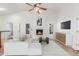 Comfortable living room with a fireplace, ceiling fan, and neutral decor at 905 E Knight Ln, Tempe, AZ 85284