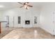 Bright living room featuring a fireplace, recessed lighting, travertine floors, and a ceiling fan at 905 E Knight Ln, Tempe, AZ 85284