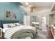 Staged bedroom with a ceiling fan, soft decor, and a mirrored closet at 905 E Knight Ln, Tempe, AZ 85284