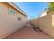 Side yard featuring rock groundcover, exterior air conditioning unit and stucco wall at 905 E Knight Ln, Tempe, AZ 85284