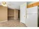 Kitchen with tiled floor, wood cabinets and white appliances at 11242 W Diana Ave, Peoria, AZ 85345