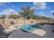 Relaxing freeform pool with large surrounding patio at 11706 W Shaw Butte Dr, El Mirage, AZ 85335