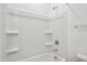 Clean bathroom with a shower/tub combo and shelving at 12421 E Bahia Ct, Florence, AZ 85132