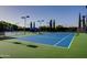 Well-maintained tennis courts with seating at 13520 W Junipero Dr, Sun City West, AZ 85375