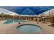 Community pool with a spa and shaded seating areas at 1850 S Martingale Rd, Gilbert, AZ 85295