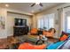 Living room with hardwood floors, comfortable seating, and large windows at 2554 E Honeysuckle Pl, Chandler, AZ 85286