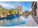 Stunning pool with waterfall feature and spacious patio area at 2554 E Honeysuckle Pl, Chandler, AZ 85286