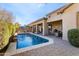 Resort-style backyard oasis with sparkling pool and covered patio at 2554 E Honeysuckle Pl, Chandler, AZ 85286