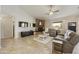 Spacious living room with stone fireplace, recessed lighting, and neutral color palette at 28206 N 141St St, Scottsdale, AZ 85262