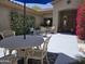 Charming front porch with an umbrella-shaded table, offering a cozy spot for outdoor relaxation at 41716 N Laurel Valley Way, Anthem, AZ 85086