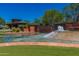 Water feature with the Anthem Country Club sign and desert landscaping on a sunny day at 41716 N Laurel Valley Way, Anthem, AZ 85086