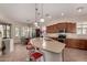 Modern kitchen with a curved island and stainless steel appliances at 5556 S Hawthorn St, Gilbert, AZ 85298