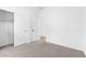 Bedroom with a view of the closet and open door to the hall at 7637 W Minton St, Laveen, AZ 85339
