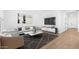 Bright living room features contemporary decor, modern furniture, and wood flooring at 7637 W Minton St, Laveen, AZ 85339