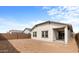 Spacious backyard featuring a stucco exterior and covered patio at 7641 W Minton St, Laveen, AZ 85339