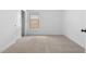 Neutral bedroom featuring carpet floors, a window with blinds, and a closet at 7641 W Minton St, Laveen, AZ 85339