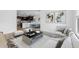 Open concept living area showcasing modern furnishings and decor including wood flooring throughout the space at 7641 W Minton St, Laveen, AZ 85339