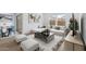 Bright living room featuring modern furnishings, wood floors, and neutral tones, creating a comfortable and inviting space at 7641 W Minton St, Laveen, AZ 85339