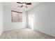 Bright bedroom with ceiling fan and window blinds at 8411 W Myrtle Ave, Glendale, AZ 85305