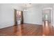 Bright dining room features hardwood floors and a view to the kitchen at 8411 W Myrtle Ave, Glendale, AZ 85305