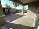 Covered patio overlooks a backyard with turf and storage shed at 8953 W Townley Ave, Peoria, AZ 85345