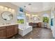 Spa-like bathroom with double vanity, large soaking tub, and separate shower at 950 E Desert Inn Dr, Chandler, AZ 85249