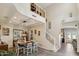 Spacious dining area with a two-story ceiling and chandelier at 950 E Desert Inn Dr, Chandler, AZ 85249