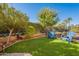 Small backyard with artificial turf and seating at 1351 E Artemis Trl, Queen Creek, AZ 85140