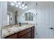 Bathroom with granite countertop, double sinks and dark wood cabinets at 1351 E Artemis Trl, Queen Creek, AZ 85140