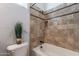 Bathroom with tub and tile surround, decorative plant at 1351 E Artemis Trl, Queen Creek, AZ 85140