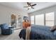 Main bedroom with king bed, access to patio, and ceiling fan at 1351 E Artemis Trl, Queen Creek, AZ 85140