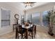 Bright breakfast nook with a wooden table and chairs at 1351 E Artemis Trl, Queen Creek, AZ 85140
