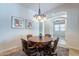 Formal dining area with chandelier and access to another room at 1351 E Artemis Trl, Queen Creek, AZ 85140